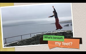 screenshot of the geology documentary film 'what's beneath our feet' - The rock showman walks upon whisky bottles atop an archaeological site in the Shetland Isles